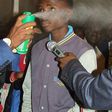 Pastor Lesotho spraying boy with doom