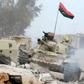 A T-54 tank belonging to forces loyal to Libya's Government of National Accord takes position in Sirte's Al-Giza Al-Bahriya district on November 21, 2016