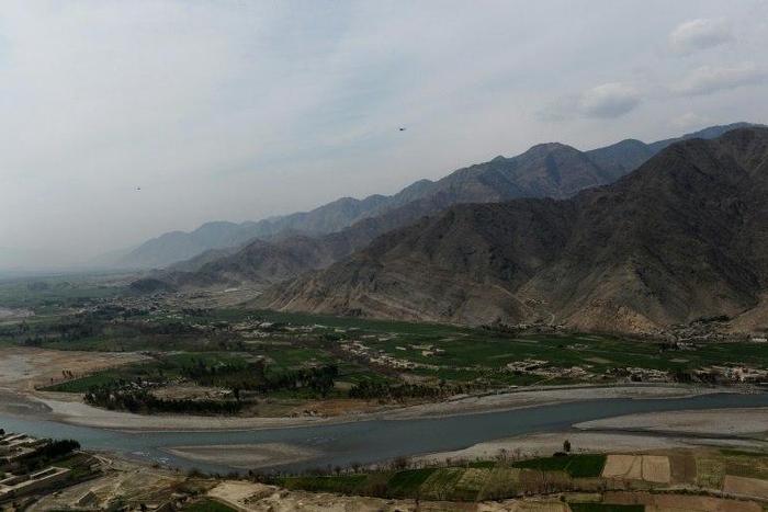 A US helicopter is seen flying over Nari district near an Afghan army outpost in Kunar province, on the border with Pakistan