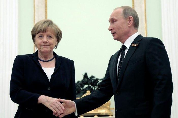 German Chancellor Angela Merkel will meet President Vladimir Putin (shown in this file photo from May 10, 2015 in Moscow) on Tuesday in her first visit to Russia since 2015 in a sign of renewed dialogue between Berlin and Moscow