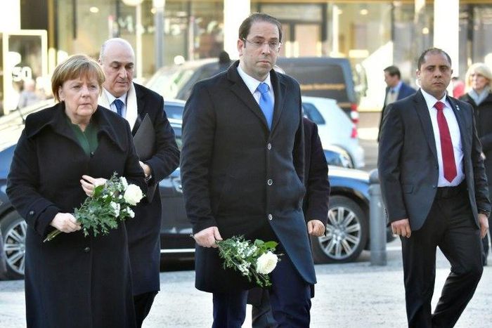 German Chancellor Angela Merkel (left) and Tunisian Prime Minister Youssef Chahed paid their respects to the victims of the Berlin Christmas Market attack as they visited the site at Breitscheidplatz, on February 14, 2017