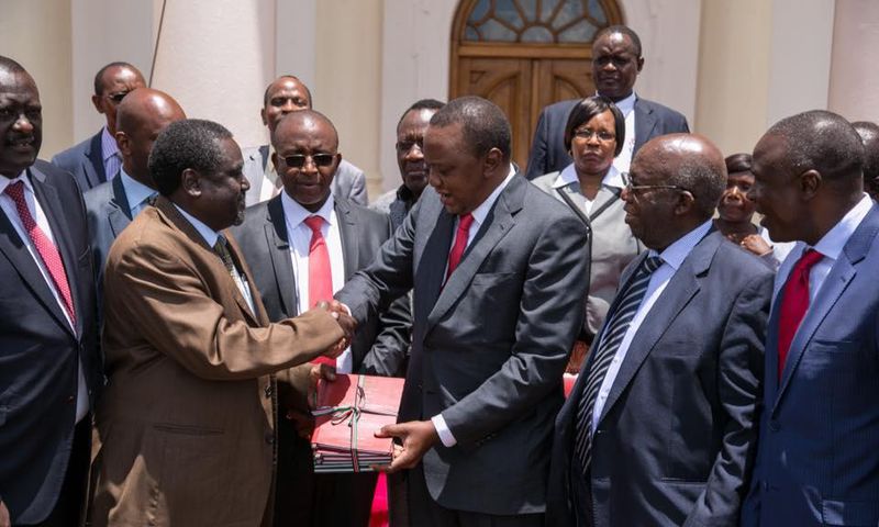 President Uhuru Kenyatta receives the miraa Task Force report at State House, Nairobi.
