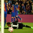 Barcelona's forward Lionel Messi celebrates with Luis Suarez after scoring a goal against Valencia at the Camp Nou stadium in Barcelona on March 19, 2017