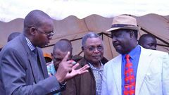 Taita Taveta governor John Mruttu explains a point to Cord leader Raila Odinga as Wundanyi MP Thomas Mwadeghu listen on at a past function last year.