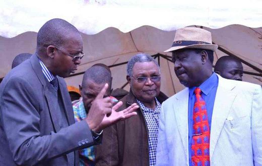 Taita Taveta governor John Mruttu explains a point to Cord leader Raila Odinga as Wundanyi MP Thomas Mwadeghu listen on at a past function last year.