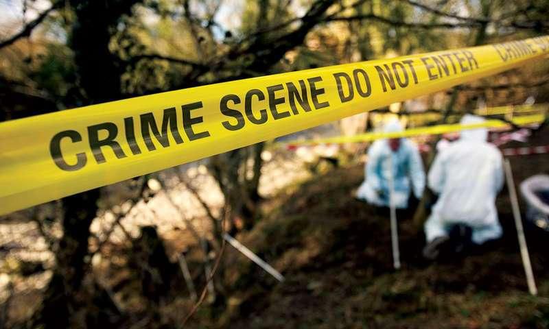 detectives at a crime scene