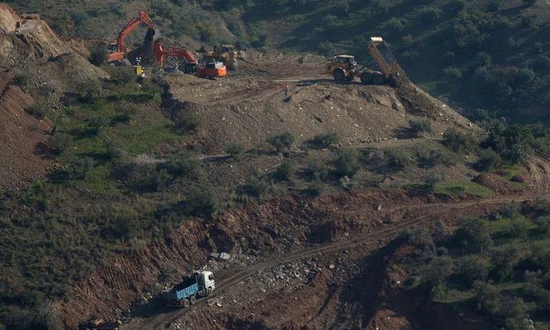 After abandoning an initial plan to reach the boy with an angled tunnel because of repeated collapses and landslides, workers turned to the possibility of drilling a vertical shaft parallel to the well