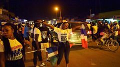 People celebrate in the streets of Banjul on January 21, 2017 after hearing of the confirmed departure of former Gambian leader Yahya Jammeh from the country