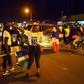 People celebrate in the streets of Banjul on January 21, 2017 after hearing of the confirmed departure of former Gambian leader Yahya Jammeh from the country