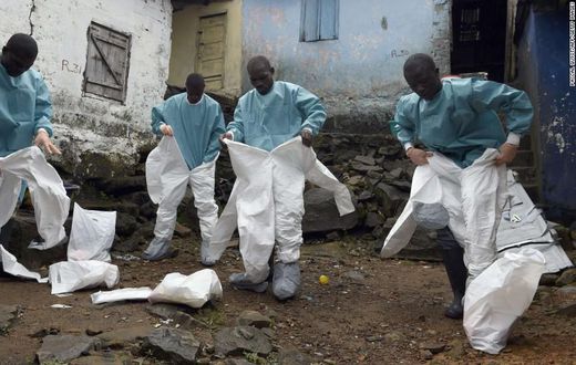 Medics gear up before interacting with Ebola patients in a West African State (CNN)