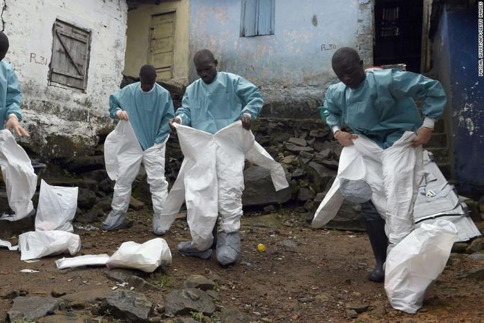 Medics gear up before interacting with Ebola patients in a West African State (CNN)