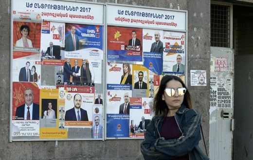 Election posters in Yerevan, where Armenians are voting in landmark legislative polls for the first time since the adoption of constitutional reforms aimed at transforming the ex-Soviet country into a parliamentary republic