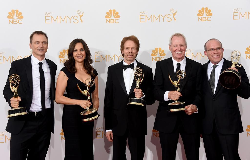 (L-R) Host Phil Keoghan, Executive Producers Elise Doganieri, Jerry Bruckheimer, Bertram van Munster and Jonathan Littman, winners of the Outstanding Reality - Competition Program Award for The Amazing Race at the Annual Primetime Emmy Awards in 2014.