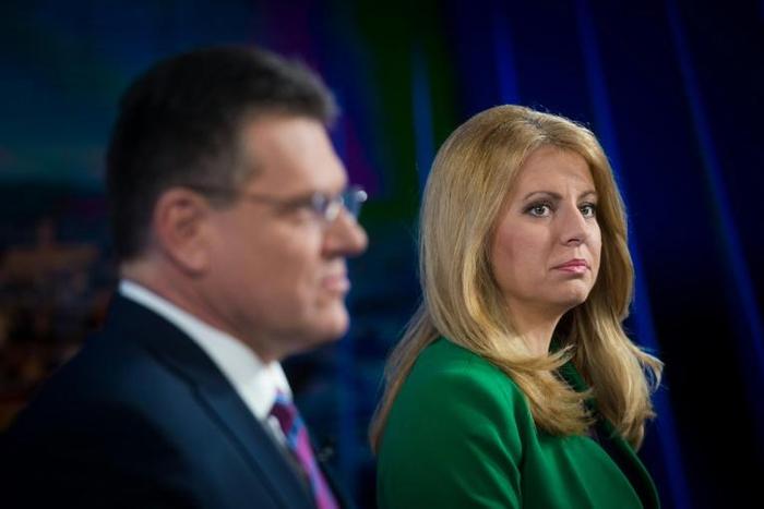 Maros Sefcovic (L) and Zuzana Caputova (R) face off in a second round vote on Saturday