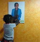 Jacque Maribe's on holding a pic of his mum (Instagram)