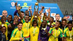 Mamelodi Sundowns' players celebrate after winning the CAF Champions League competition following their final match against Egypt's Zamalek, at the Borg el-Arab Stadium near Alexandria, on October 23, 2016