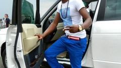 Ringtone posing next to his German machine