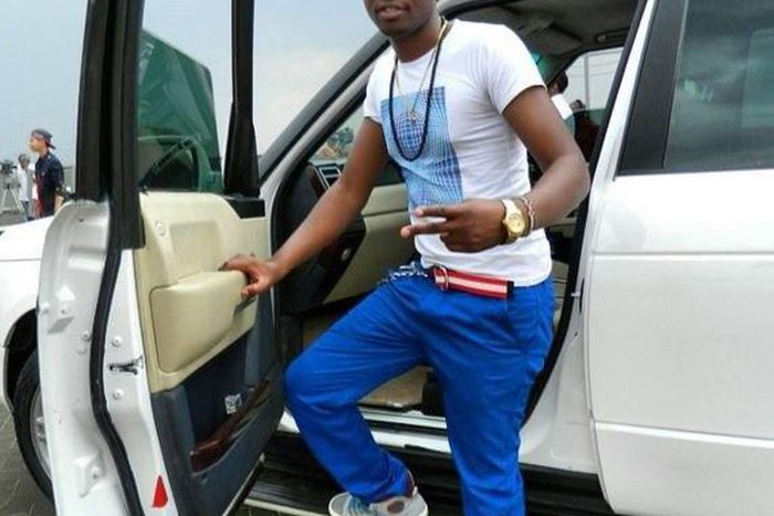 Ringtone posing next to his German machine