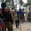 Rebel fighters queue to enter an armoured vehicle near the town of Bizaah northeast of the city of Al-Bab on February 4, 2017