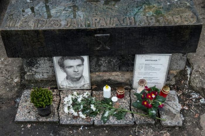 Flowers and candles stand at the grave in Prague of Jan Palach, who burnt himself to death 50 years ago to protest at the Soviet-led occupation of then Czechoslovakia