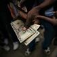 Public transport drivers complain about having to pay for fuel in US dollars after the government more than doubled prices, sparking widespread protests