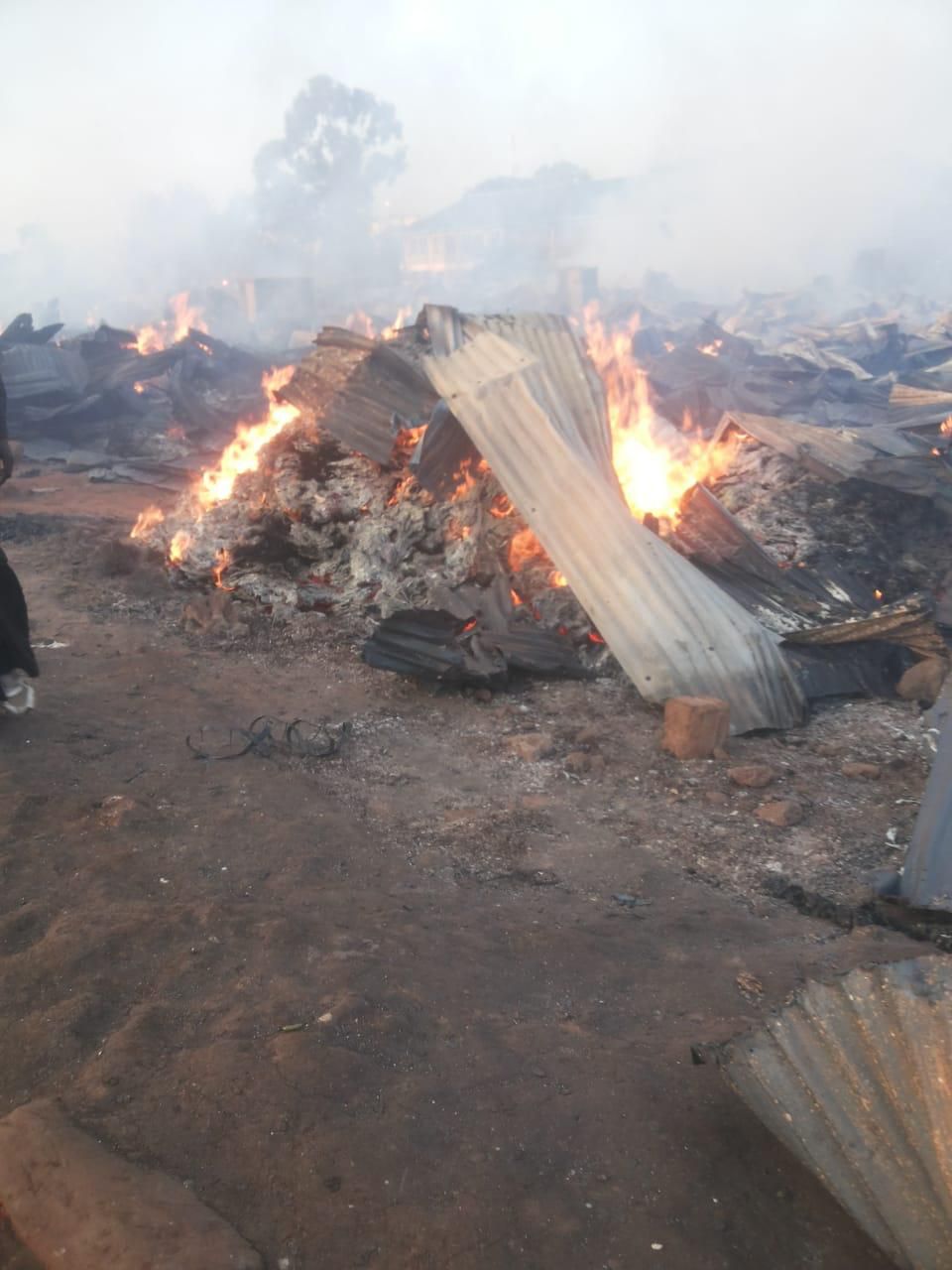 Structures still in flames at the Toi Market after fire broke out at dawn (Oliver Oketch)