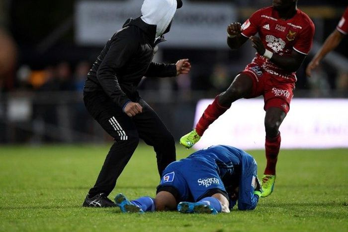 A masked fan attacked a goalkeeper during a football match in the southern Swedish city of Jonkoping on August 15, 2016. Sweden on Wednesday announced plans to ban fans from covering their faces at sporting venues