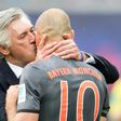Munich's head coach Carlo Ancelotti kisses scorer midfielder Arjen Robben after his goal during the German first division Bundesliga football match against Leipzig May 13, 2017