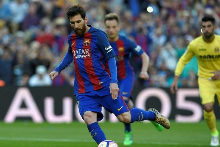 Barcelona's forward Lionel Messi shoots a penalty kick to score a goal during the Spanish league football match FC Barcelona vs Villarreal CF at the Camp Nou stadium in Barcelona on May 6, 2017