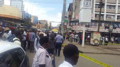 Nairobi residents look on as police cordon off an area along Latema Road where a suspicious box was left (Twitter)