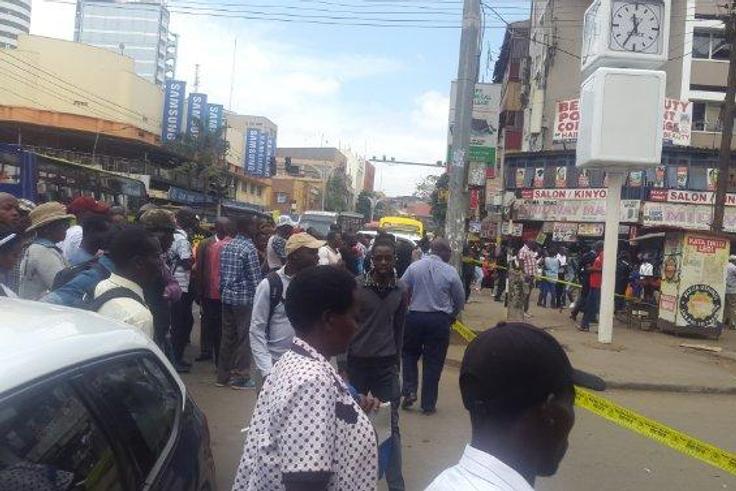 Nairobi residents look on as police cordon off an area along Latema Road where a suspicious box was left (Twitter)