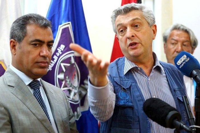 UNHCR chief Filippo Grandi during a press conference at the Tripoli branch of the Illegal Immigration Authority, next to its director Colonel Mohammed Beshr, on May 21, 2017