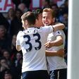 Tottenham Hotspur's Harry Kane (R) celebrates scoring his side's third goal in a 4-0 rout against Bournemouth on April 15, 2017