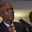 Jovenel Moise (L), presidential candidate of the PHTK party, speaks after preliminary results showed he had won the first round of Haiti's election on November 28, 2016