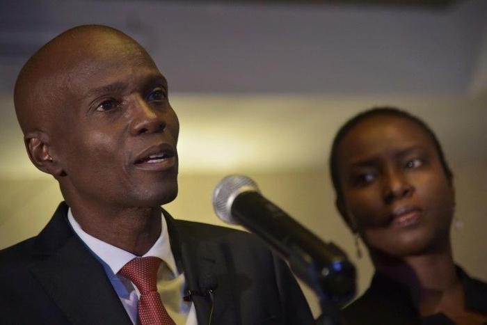 Jovenel Moise (L), presidential candidate of the PHTK party, speaks after preliminary results showed he had won the first round of Haiti's election on November 28, 2016