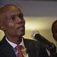 Jovenel Moise (L), presidential candidate of the PHTK party, speaks after preliminary results showed he had won the first round of Haiti's election on November 28, 2016