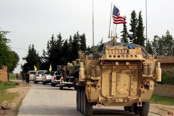 US forces accompanied by Kurdish People's Protection Units fighters near the northern Syrian village of Darbasiyah on the border with Turkey on April 28, 2017