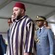 The King of Morocco, Mohammed VI (C) is welcomed by Rwandan President Paul Kagame (L) on October 19, 2016 in Kigali, during his first stage tour of East Africa