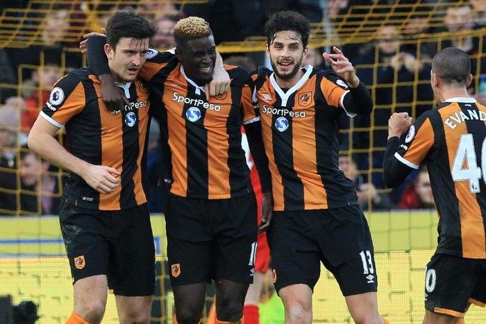 Hull City's Alfred N'Diaye (2nd L) celebrates with teammates after scoring a goal during their English Premier League match against Liverpool, at the KCOM Stadium in Kingston upon Hull, on February 4, 2017