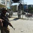 An Pakistani soldier cordons off the site of a bomb attack in Lahore, on February 23, 2017