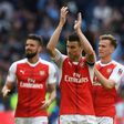 L-R: Arsenal's striker Olivier Giroud and defenders Laurent Koscielny and Rob Holding celebrate victory on April 23, 2017