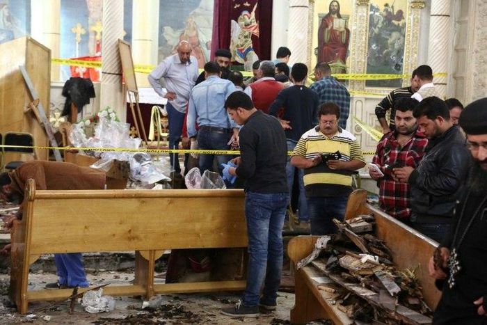 Forensics collecting evidence at the site of a bomb blast which struck worshippers gathering to celebrate Palm Sunday at the Mar Girgis Coptic Church in the Nile Delta City of Tanta, 120 kilometres north of Cairo, on April 9, 2017