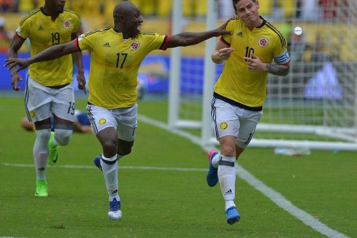 Colombia's midfielder James Rodriguez (R) celebrates next to teammate Pablo Armero after scoring a penalty against Bolivia during their 2018 FIFA World Cup qualifier football match in Barranquilla, on March 23, 2017