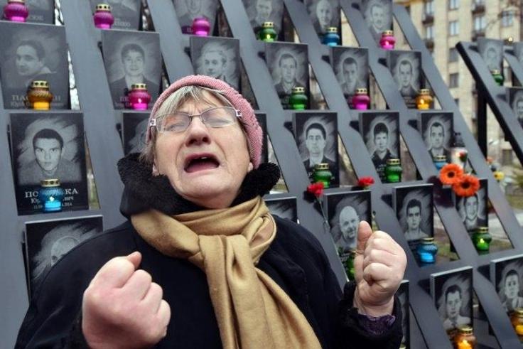 A woman cries at a memorial in Kiev for activists who lost their lives in February 2014, on November 21, 2016