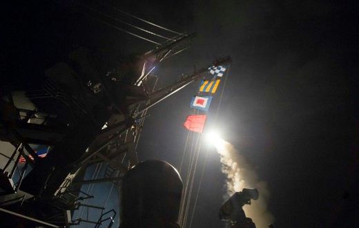 In this image released by the US Navy, the USS Ross based in the Mediterranean fires a Tomahawk land attack missile April 7, 2017, at a Syrian air force airfield