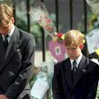 Prince William (left) and Prince Harry bow their heads during the funeral of their mother Diana, Princess of Wales, at Westminster Abbey in 1997