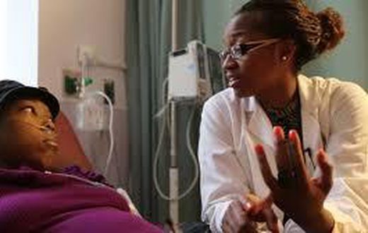 A nurse attending to a sickle cell patient.