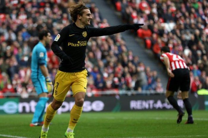 Atletico Madrid's French forward Antoine Griezmann celebrates after scoring during the Spanish league football match Athletic Club Bilbao vs Club Atletico de Madrid at the San Mames stadium in Bilbao on January 22, 2017