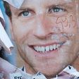 A vandalised electoral campaign poster of Emmanuel Macron in the run-up to the presidential election
