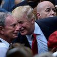Then US Republican presidential nominee Donald Trump (R) speaks to former New York mayor Michael Bloomberg during a memorial service at the National 9/11 Memorial in New York on September 11, 2016